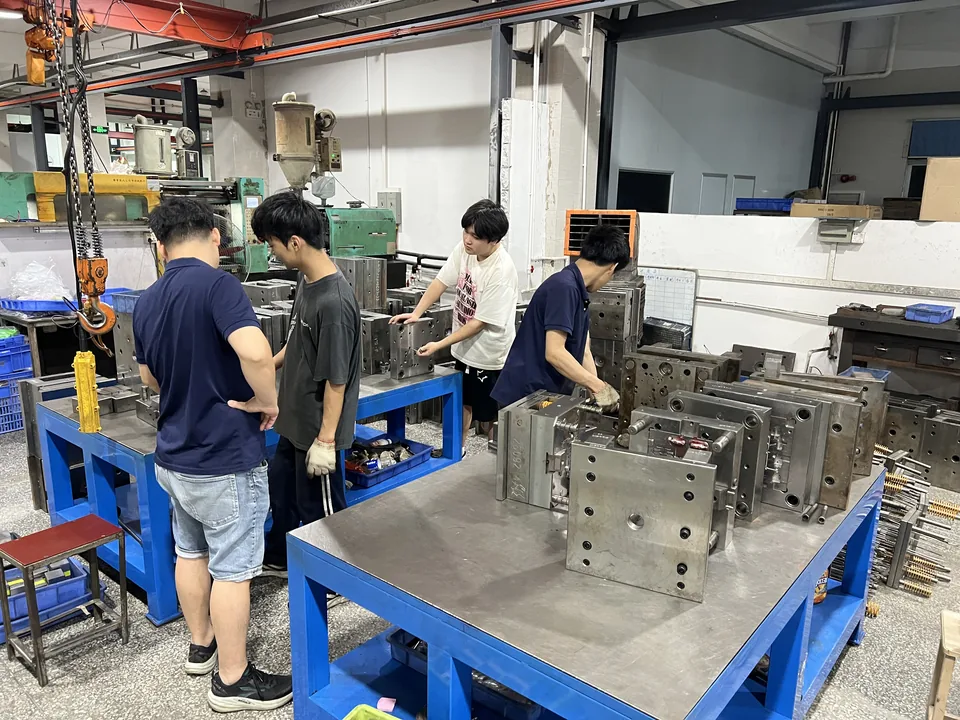 The workshop team working on molds at benches